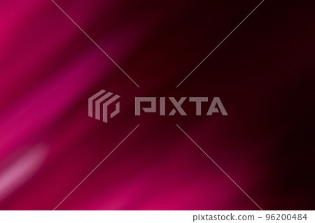 Light leak. Defocused glow overlay. Luminous lens flare. Blur neon magenta pink color rays on dark black abstract copy space background. 96200484