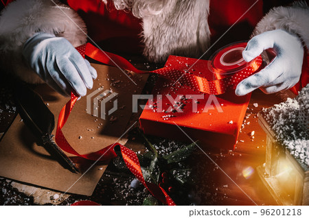 Santa claus writes a letter good wishes for Christmas gifts Santa claus writes a letter good wishes for Christmas gifts 96201218