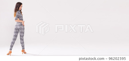 Banner Latin dance, bachata lady, jazz modern and vogue dance concept - Beautiful young woman dancing on white background with copy space 96202395