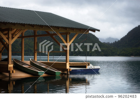 Lake of Alpsee in Schwangau with rowboats, germany Lake of Alpsee in Schwangau with rowboats, germany 96202483