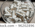 Tablets, capsules, antibiotics. Disease prevention. Treatment for colds and flu. Coronavirus. Receptor drugs. White and green pills. 96202896