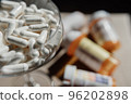 Tablets, capsules, antibiotics. Disease prevention. Treatment for colds and flu. Coronavirus. Receptor drugs. White and green pills. 96202898