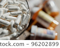 Tablets, capsules, antibiotics. Disease prevention. Treatment for colds and flu. Coronavirus. Receptor drugs. White and green pills. 96202899