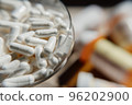 Tablets, capsules, antibiotics. Disease prevention. Treatment for colds and flu. Coronavirus. Receptor drugs. White and green pills. 96202900