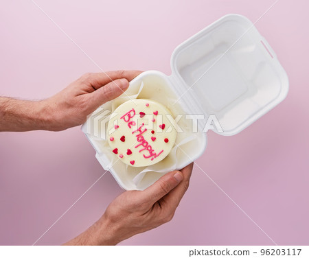 man holds Bento cake with text Be happy in takeout box man holds Bento cake with text Be happy in takeout box 96203117