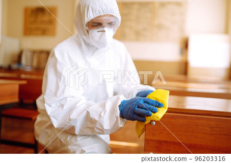Cleaning and disinfection school desk during coronavirus pandemic. COVID-19. Cleaning and disinfection school desk during coronavirus pandemic. COVID-19. 96203316