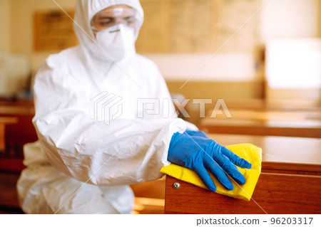 Cleaning and disinfection school desk during coronavirus pandemic. COVID-19. Cleaning and disinfection school desk during coronavirus pandemic. COVID-19. 96203317