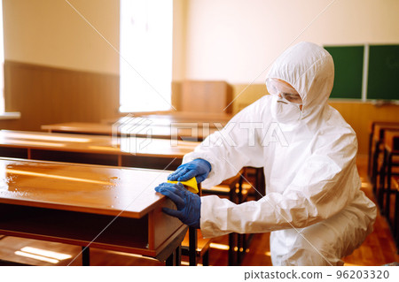 Cleaning and disinfection school desk during coronavirus pandemic. COVID-19. Cleaning and disinfection school desk during coronavirus pandemic. COVID-19. 96203320