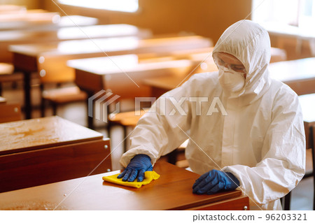 Cleaning and disinfection school desk during coronavirus pandemic. COVID-19. Cleaning and disinfection school desk during coronavirus pandemic. COVID-19. 96203321