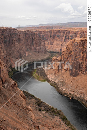 Aerial View Of Colorado River Flowing Amidst Majestic Canyons At Glen Canyon Dam In Arizona During Summer 96206794