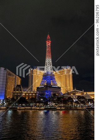 Las Vegas, USA. September 16, 2022. Illuminated Replica of Eiffel tower and Paris Las Vegas Hotel at promenade. View of luxurious casinos in Las Vegas city with dark sky in background during night. Las Vegas, USA. September 16, 2022. Illuminated Replica of Eiffel tower and Paris Las Vegas Hotel at promenade. View of luxurious casinos in Las Vegas city with dark sky in background during night. 96206795