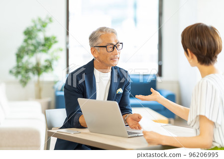 Senior businessman and middle woman 96206995