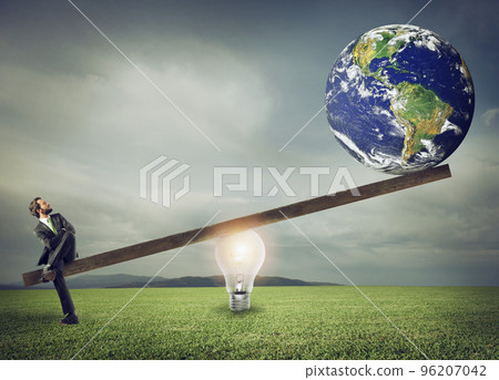 Businessman uses a lightbulb ad lever to lift the World. Earth provided by Nasa. 96207042