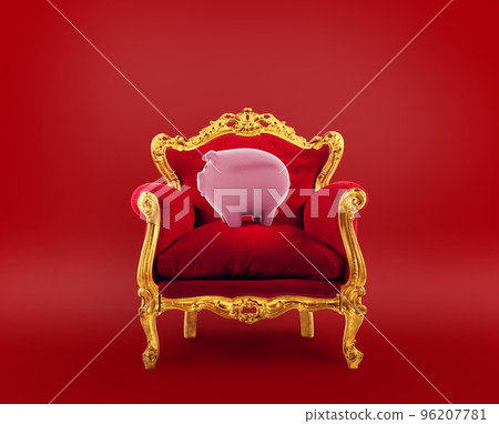 Comfortable red and golden armchair with a piggybank. Concept as premier savings service 96207781
