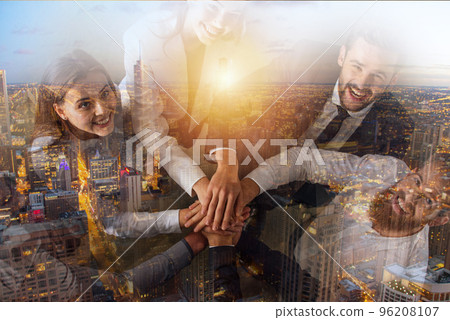 Business people putting their hands together. Concept of teamwork and partnership 96208107