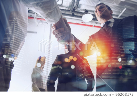 Handshaking business person in office. concept of teamwork and partnership. 96208172