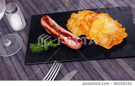 National dish of Belarusian cuisine is draniki with fried sausages National dish of Belarusian cuisine is draniki with fried sausages 96208192