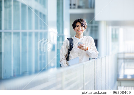 A man operating a smartphone A man operating a smartphone 96208409