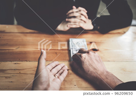 Corrupt concept, corrupt private entrepreneurs are handing over money to government employees to offer to sign contracts that benefit their company. Corrupt concept, corrupt private entrepreneurs are handing over money to government employees to offer to sign contracts that benefit their company. 96209650