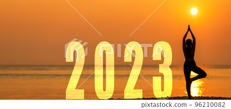 Happy new year card 2023. Silhouette lifestyle woman yoga practicing yoga standing as part of Number 2023  96210082
