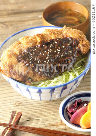 Hot miso cutlet bowl with plenty of cabbage, hot miso soup and pickles Hot miso cutlet bowl with plenty of cabbage, hot miso soup and pickles 96211167