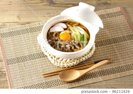 Miso stewed udon with beef, shimeji mushrooms, green onion, kamaboko, and egg yolk 96211826