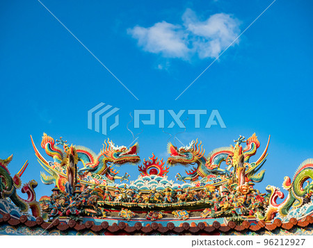 Asia culture concept - Roof with beautiful decoration of famous heritage landmark, the traditional old oriental Taiwanese temple. Asia culture concept - Roof with beautiful decoration of famous heritage landmark, the traditional old oriental Taiwanese temple. 96212927