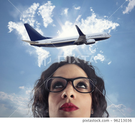 Woman wants to take a break from her work for a airplane trip 96213036