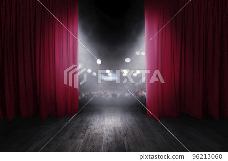 The red curtains are opening for the theater show 96213060
