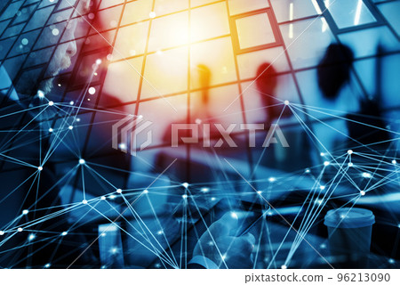 Business man works in office with tablet in the foreground. Concept of teamwork and partnership. double exposure with network effects 96213090