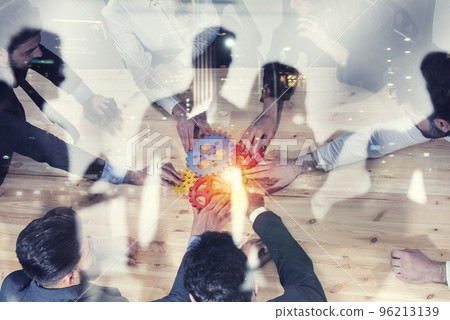 Business team connect pieces of gears. Photo from above. Teamwork, partnership and integration concept. Double exposure Business team connect pieces of gears. Photo from above. Teamwork, partnership and integration concept. Double exposure 96213139