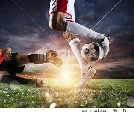 Soccer players with soccerball at the stadium during the match Soccer players with soccerball at the stadium during the match 96213501