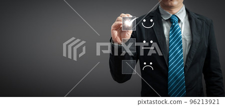 a businessman in a suit holding a pen touching the virtual screen on the happy Smiley face icon to give satisfaction in service.rating very impressed.Customer service and Satisfaction concept a businessman in a suit holding a pen touching the virtual screen on the happy Smiley face icon to give satisfaction in service.rating very impressed.Customer service and Satisfaction concept 96213921