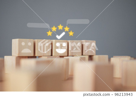 A checked wood block has five star with smile. It shows an excellent job and best service for customer. Evaluation and satisfaction concept. A checked wood block has five star with smile. It shows an excellent job and best service for customer. Evaluation and satisfaction concept. 96213943
