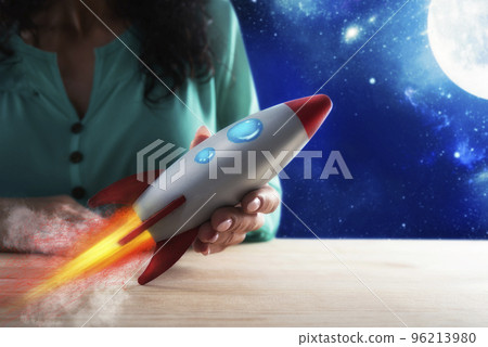 Businesswoman launches his company with a rocket. Concept of startup and innovation Businesswoman launches his company with a rocket. Concept of startup and innovation 96213980