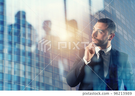 Businessman thinks new strategies to grow up the company. double exposure 96213989