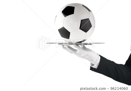 Waiter that holds a tray with soccer ball. Concept of first class service on soccer Waiter that holds a tray with soccer ball. Concept of first class service on soccer 96214060