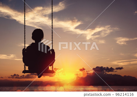 Freedom and carefree of a young female on a swing 96214116