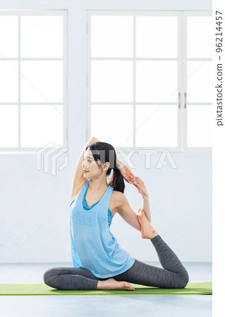 Yoga woman stretching yoga studio 96214457