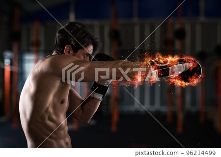 Confident boxer with fiery boxing gloves 96214499