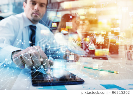 Businessman with a tablet that shares multimedia with internet connection Businessman with a tablet that shares multimedia with internet connection 96215202
