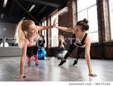 Two friend at the gym doing pushup Two friend at the gym doing pushup 96215268