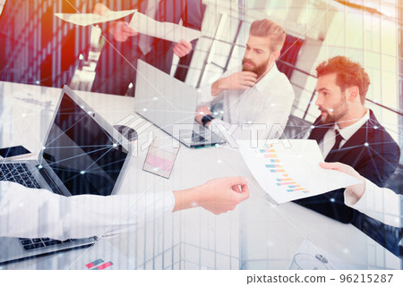 Businessmen that work together in office. Concept of teamwork and partnership. double exposure 96215287