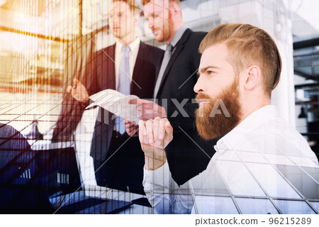 Businessmen that work together in office. Concept of teamwork and partnership. double exposure Businessmen that work together in office. Concept of teamwork and partnership. double exposure 96215289
