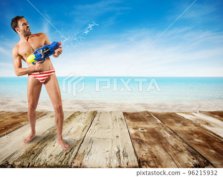 Boy play with water gun Boy play with water gun 96215932