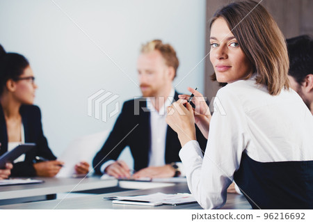 Confident businesswoman during a business meeting Confident businesswoman during a business meeting 96216692
