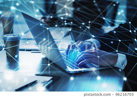 Man working on a laptop. Concept of internet sharing and interconnection Man working on a laptop. Concept of internet sharing and interconnection 96216703