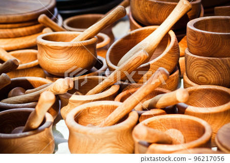 Handmade wooden mortars and pestles on a market stall 96217056