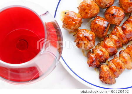 Yakitori (sauce) slowly grilled over charcoal and a glass of red wine Yakitori (sauce) slowly grilled over charcoal and a glass of red wine 96220402