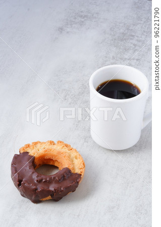 Relax with chocolate-coated old-fashioned donuts and coffee Relax with chocolate-coated old-fashioned donuts and coffee 96221790